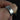 Close-up of Gael 8mm 14kt Rose Gold & Silver Tungsten Carbide Trio Striped Wedding Ring on finger