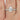 Gorgeous 150ct EXTRA LOW Vienna 9x6mm 14kt White Gold Forever One Moissanite Diamond Scarf Halo Pear Engagement Ring displayed on a velvet jewelry box