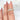 14kt gold eternity ring with moissanite diamond halo and intricate detailing