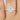 Close-up image of 14kt Gold Rainbow Moonstone Diamond Oval Halo Ring on a woman's finger, showcasing its stunning 8x6mm moonstone and diamond accents