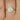 1ct pear shaped moissanite diamond bezel ring in 14kt gold setting with half halo design