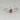 Alt text: Elegant 14kt white gold engagement ring with vintage burgundy red sapphire and diamond halo