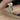 Skinny Lois 10x8mm Petite Naomi Kubian 14kt Rose Gold Oval Moissanite and Diamond TRIO Bridal Set bridal set displayed on a cushion, showcasing its stunning design and brilliant sparkle