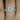 Naomi 8mm 14kt White Gold Round Moissanite and Diamonds Double Talon Bridal Set, a stunning and elegant ring perfect for any special occasion
