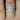 Mae 8x6mm & Christie 14kt White Gold Oval Moissanite and Diamond Halo Bridal Set ring on woman's finger