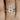 Beautiful 14kt rose gold bridal set featuring 9x7mm emerald moissanite and diamond accents