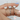 Hand-modeled image of Celeste 8x6mm 14kt White Gold Oval Moissanite and Diamonds Pave Halo Engagement Ring featuring stunning oval moissanite surrounded by pave diamonds