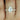 Shimmering 14kt rose gold band with notched design to complement Ann 10x7mm diamonds almost eternity band