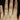 Odala 55mm 14kt Rose Gold Round Moissanite and Diamonds Twisted Classic Bridal Set engagement ring on a woman's finger