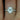 Side view of Federella 8x6mm 14kt Gold Oval Moissanite and Diamond Halo Engagement Ring