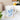 White mug with artistic blue topaz crystal design and inspirational text, styled in a cozy kitchen