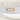 Rose gold ring with small diamonds on a soft white background