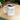 White mug with June birthstone text filled with coffee on wooden table by Printify