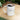 White ceramic mug with citrine-themed November birthstone text filled with coffee on wooden table by Printify