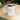 White ceramic mug with Topaz December birthstone text filled with coffee on wooden table by Printify