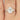 Close-up image of 230cts Cassie 9x7mm 14kt Moissanite Diamonds Unique Cluster 3 Stone Elongated Cushion Engagement Ring, showcasing its elegant design and brilliant sparkle