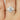 3ct Ready to Ship Cinderella 10x8mm 14kt Rose Gold Moissanite Diamond Oval Cluster Ring displayed in elegant jewelry box