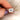 emerald cut set east west on diamond band with matching diamond band betweenn pointer finger and thumb