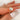  Elegant and timeless 14kt Gold Moissanite Diamond Emerald Cut Solitaire Ring on a woman's hand