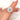Close up of 3ct Cara 10x8mm 14kt Gold Moissanite Diamond Oval Double Halo Ring on woman's hand
