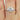  Beautifully crafted Elise 8mm 14kt White Gold Round Moissanite and Diamond Pear Engagement Ring on a velvet display