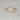 Close-up of Willis 7mm 14kt Rose Gold Round Moissanite Diamonds Hexagon Halo Engagement Ring without Milgrain detailing on a white background