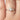 075ct Greta 7x5mm 14kt Gold Moissanite Pear Three Stone Ring with diamond accents