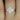 Stylish 14kt rose gold oval moissanite and diamond halo engagement ring