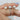  Elegant and luxurious Skinny Flora 8mm & Christie 14kt Rose Gold Round Moissanite and Diamonds Bridal Set on a woman's hand