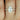 Close-up of the pear-shaped moissanite stone in the Ann 10x7mm 14kt Rose Gold Pear Moissanite and Diamonds Cathedral Engagement Ring