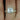 Pernella 7mm 14kt Yellow Gold Cushion Moissanite and Diamonds Halo Classic Bridal Set ring on a woman's hand