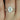 Rebecca 8x6mm & Gwen 14kt Rose Gold Oval Moissanite and Diamond Halo Bridal Set - A stunning bridal ring set featuring a sparkling oval moissanite stone surrounded by a halo of shimmering diamonds in a rose gold setting