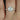 Top view of the 7mm moissanite stone set in the rose gold engagement ring