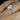 Detailed view of the halo setting with sparkling diamonds surrounding the center stone