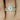 Hillary 9x7mm & Naomi 14kt Rose Gold Oval Moissanite and Diamond Basket TRIO Bridal Set featuring a stunning rose gold oval moissanite and diamond design