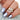 Handcrafted 14kt gold engagement ring set with marquise diamond and round moissanite accents by rosados box