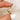 1.50ct Petite Tula 12x6mm & Merida 14kt Diamond Crossover Marquise Bridal Set pinched between fingers