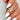bypass Gold wedding ring with a marquise diamond on a hand with white nail polish