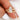 Gold ring with a large marquise diamond on a finger