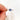 oval cluster ring with cornflower sapphire center stone pinched between finger