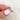 oval cluster sapphire ring with lavender sapphire in rose gold held by two fingers