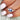 cornflower blue sapphire trilogy ring on ring finger and over seafoam sleeves