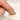 oval green sapphire ring in trilogy style with two diamonds on yellow gold on pointer finger