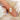 moval diamond ring with button back and knife edge shank on pointer finger