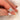 150ct Jadis 8x6mm 14kt Gold Moissanite Diamonds Polaris Oval Halo Bridal Set sparkling on a woman's hand, showcasing its elegant design and brilliance