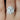 Katherine 10x8mm 14kt White Gold Oval Moissanite and Diamond Flower Petal Halo Engagement Ring showcasing stunning floral design with dazzling gemstones