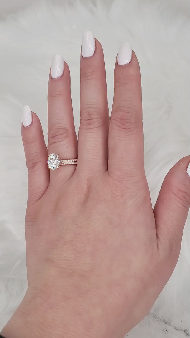 oval solitaire with accent with matching diamond band view