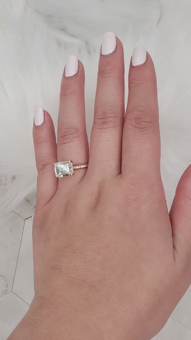 Becca east west emerald cut solitaire video on hand